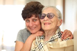 Happy woman with elderly mother
